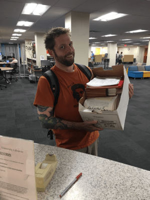 Martin Pfeiffer with a box of National Nuclear Security Administration FOIA documents.