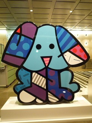 A pop art representation of a puppy dog, mostly in different shades of blue