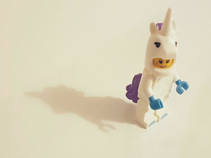 Lego minifig in unicorn costume. Image from Ines Pimentel | unsplash.com