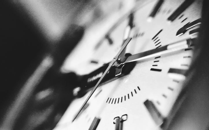 Black and white close-up of a watch face. Image from Noor Younis | unsplash.com