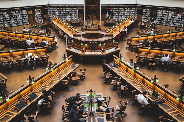 An old library with desks radiating out from a central area. The librarian in the centre could watch what everyone at a desk was doing. There is no librarian in the centre these days. 